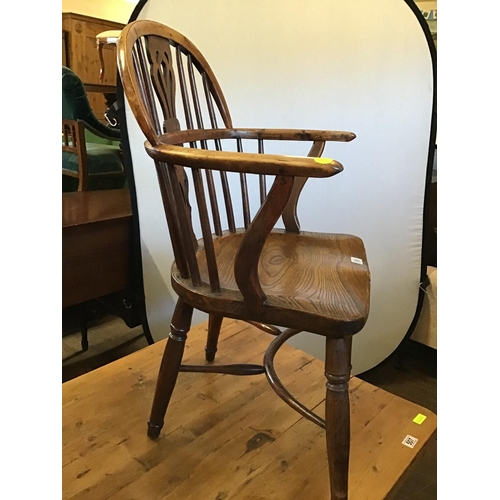 506 - EARLY OAK STRETCHERED FIDDLEBACK ARMCHAIR