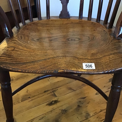 506 - EARLY OAK STRETCHERED FIDDLEBACK ARMCHAIR