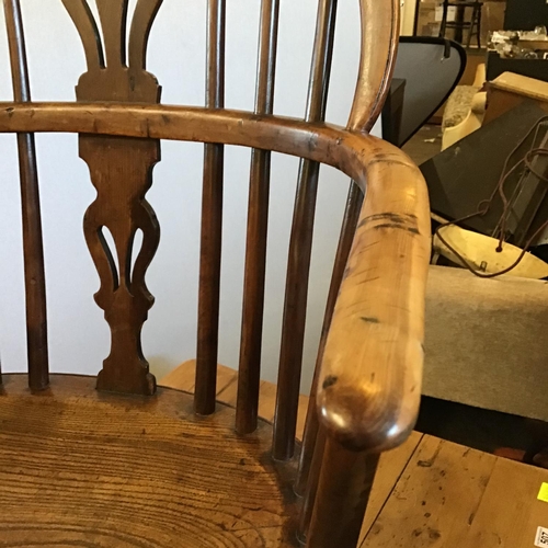 506 - EARLY OAK STRETCHERED FIDDLEBACK ARMCHAIR