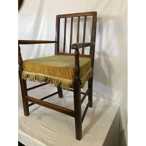 629 - EARLY OAK STRETCHERED ARMCHAIR WITH CUSHION