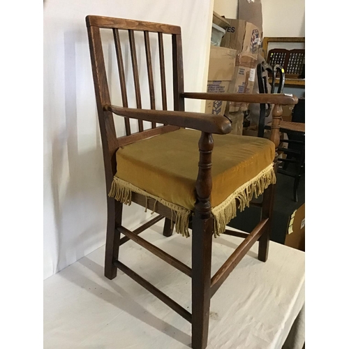 629 - EARLY OAK STRETCHERED ARMCHAIR WITH CUSHION