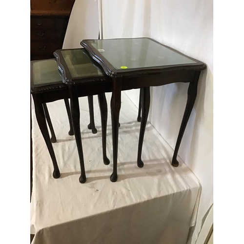 636 - REPRODUCTION  NEST OF TABLES WITH GLASS TOPS AND LEATHER INSETS
L 22