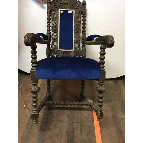 649 - HEAVILY CARVED OAK UPHOLSTERED ARMCHAIR