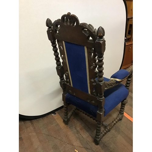 649 - HEAVILY CARVED OAK UPHOLSTERED ARMCHAIR