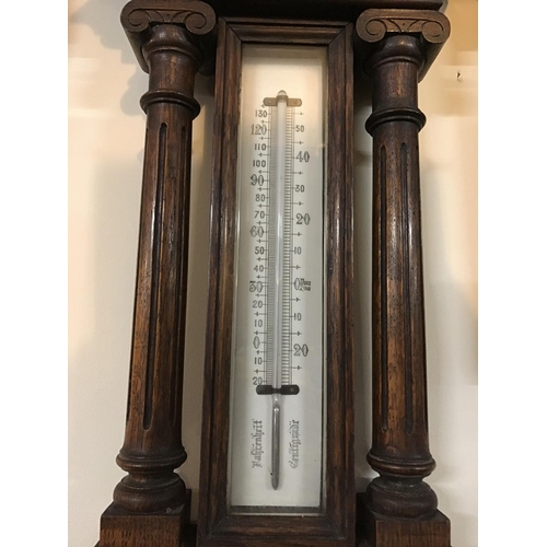 706 - CARVED OAK FRAMED WALL BAROMETER A/F
H 42