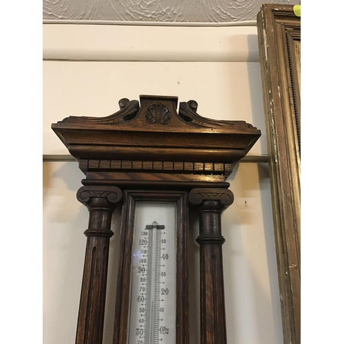 706 - CARVED OAK FRAMED WALL BAROMETER A/F
H 42