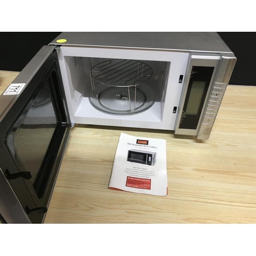 711 - ELECTRIC MICROWAVE OVEN W/O