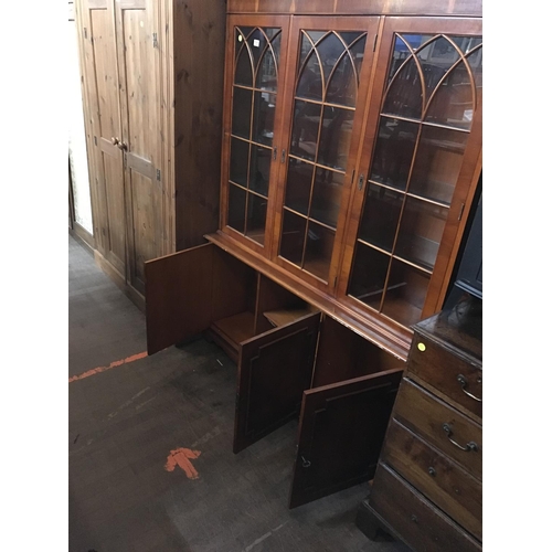 727 - YEW WOOD 3 DOOR GLAZED BOOKCASE
57 X 14