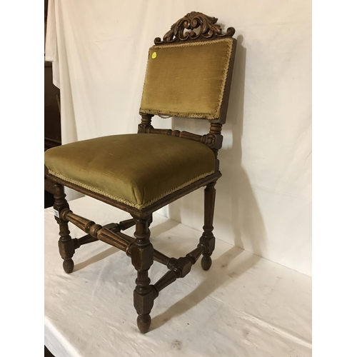 732 - OAK CARVED AND STRETCHERD HALL CHAIR