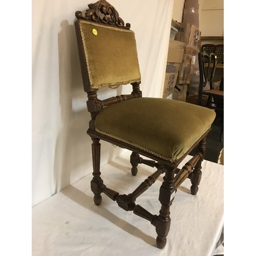 732 - OAK CARVED AND STRETCHERD HALL CHAIR