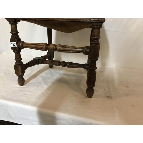 732 - OAK CARVED AND STRETCHERD HALL CHAIR