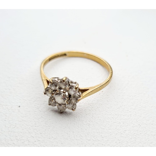 351 - 9CT GOLD LADIES DRESS RING WITH FLOWER TYPE SETTING