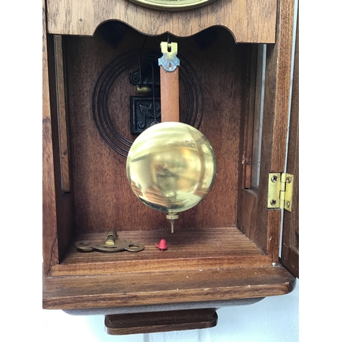 14 - MODERN OAK WALL CLOCK C/W KEY