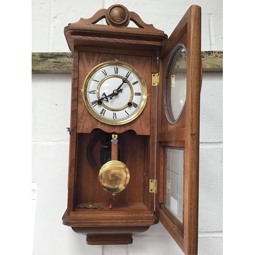 14 - MODERN OAK WALL CLOCK C/W KEY