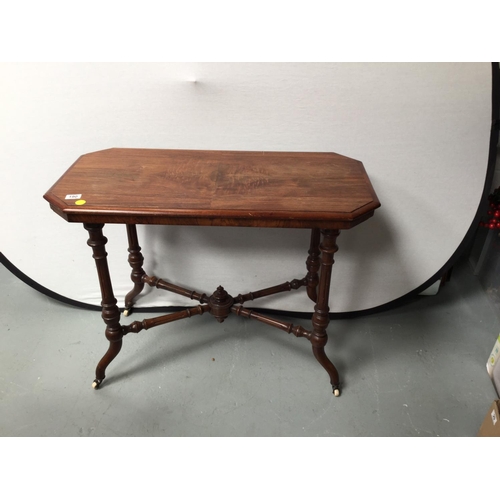 190 - VICTORIAN MAHOGANY STRETCHERED WINDOW TABLE ON CHINA AND BRASS CASTORS
36