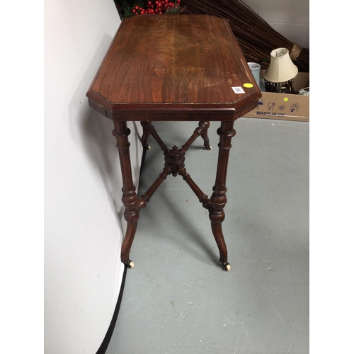190 - VICTORIAN MAHOGANY STRETCHERED WINDOW TABLE ON CHINA AND BRASS CASTORS
36