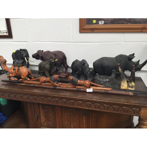 77 - QTY OF CARVED ANIMAL FIGURES, SPEARS, ETC