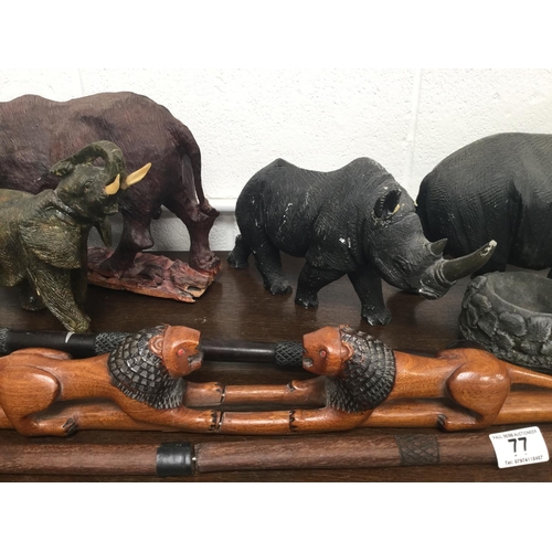 77 - QTY OF CARVED ANIMAL FIGURES, SPEARS, ETC