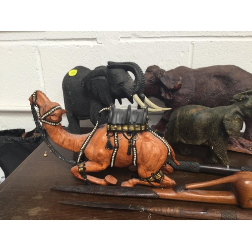 77 - QTY OF CARVED ANIMAL FIGURES, SPEARS, ETC