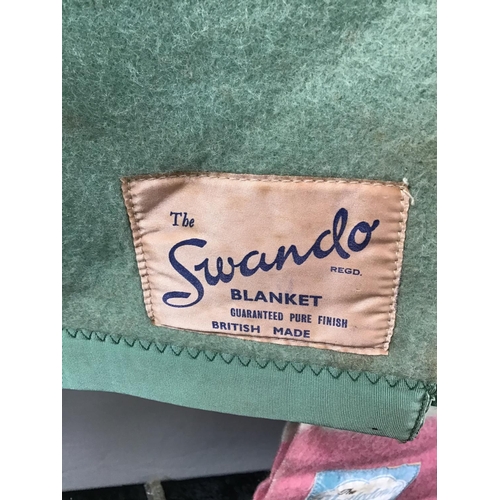 194 - 2 VINTAGE BLANKETS 
1 LABELLED THE SWANDO 
1 LABELLED NESTLEDOWN