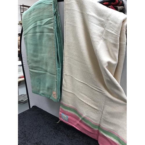 194 - 2 VINTAGE BLANKETS 
1 LABELLED THE SWANDO 
1 LABELLED NESTLEDOWN