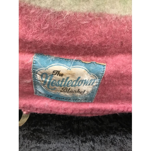 194 - 2 VINTAGE BLANKETS 
1 LABELLED THE SWANDO 
1 LABELLED NESTLEDOWN