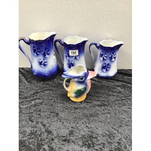 195 - 3 GRADUATED FLO BLUE JUGS AND BIRD JUG