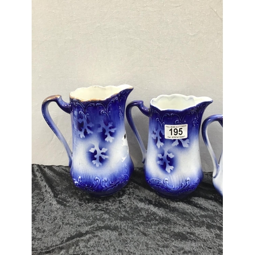 195 - 3 GRADUATED FLO BLUE JUGS AND BIRD JUG