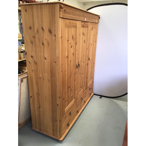 223 - PINE TRIPLE WARDROBE WITH 5 DRAWERS TO BASE 
61