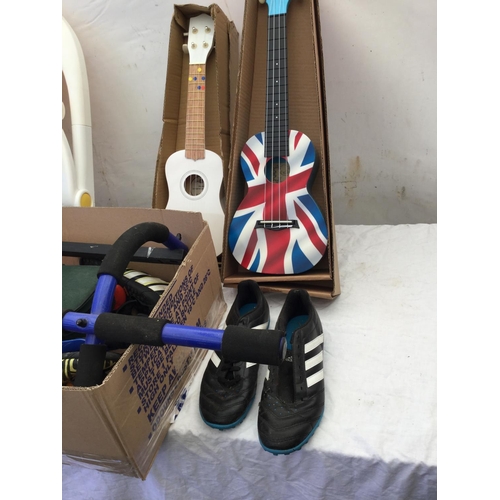 89 - BOX OF FOOTBALL BOOTS, TOY GUITARS, CHILDS SEAT AND BOULES