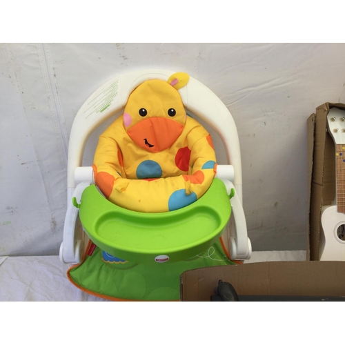 89 - BOX OF FOOTBALL BOOTS, TOY GUITARS, CHILDS SEAT AND BOULES