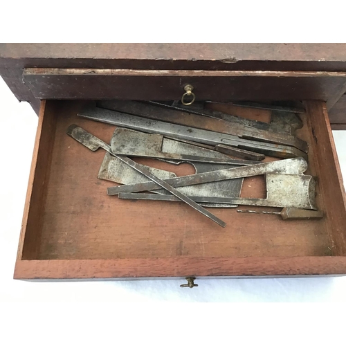 215 - LARGE VICTORIAN PINE TOOL BOX FITTED WITH BANKS OF DRAWERS COMPLETE WITH VICTORIAN TOOLS ETC