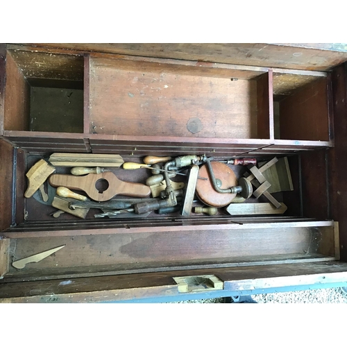 215 - LARGE VICTORIAN PINE TOOL BOX FITTED WITH BANKS OF DRAWERS COMPLETE WITH VICTORIAN TOOLS ETC