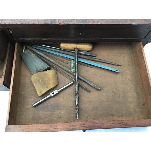 215 - LARGE VICTORIAN PINE TOOL BOX FITTED WITH BANKS OF DRAWERS COMPLETE WITH VICTORIAN TOOLS ETC