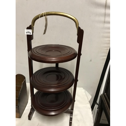 494 - VINTAGE MAHOGANY FOLDING CAKE STAND WITH BRASS CARRY HANDLE AND AN OAK LETTER RACK