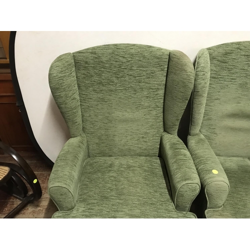 507 - 2 GREEN UPHOLSTERED WING BACK ARMCHAIRS  ON CABRIOLE LEGS