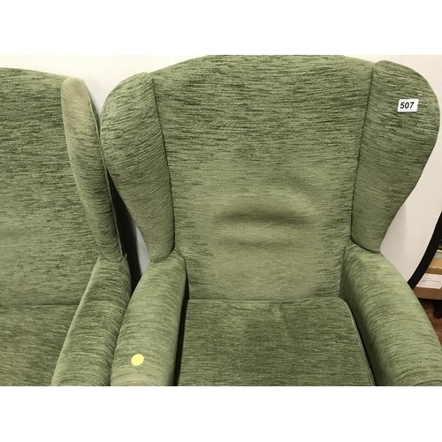 507 - 2 GREEN UPHOLSTERED WING BACK ARMCHAIRS  ON CABRIOLE LEGS