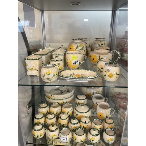 355 - LARGE QTY OF GLAZED POTTERY WITH FLORAL DESIGN YELLOW AND GREEN TO INC VASES BOWLS CHEESE DISHES ETC