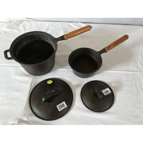 288 - 2 CAST IRON COOKING PANS WITH COVERS