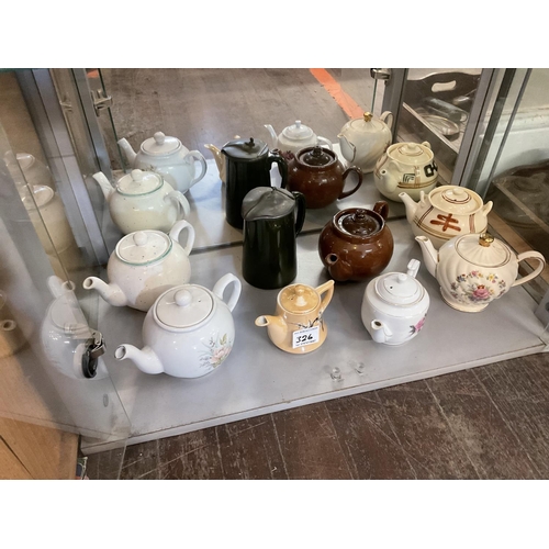 326 - QTY OF NOVELTY TEA POTS ETC