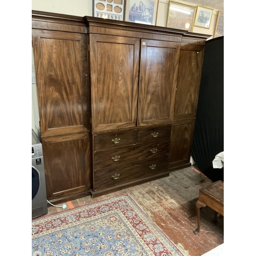 632 - GEORGIAN BREAK FRONT MAHOGANY COMPACTOM WARDROBE. 2 CUPBOARD DOORS OVER 4 DRAWERS FLANKED BY 2 HANGI... 