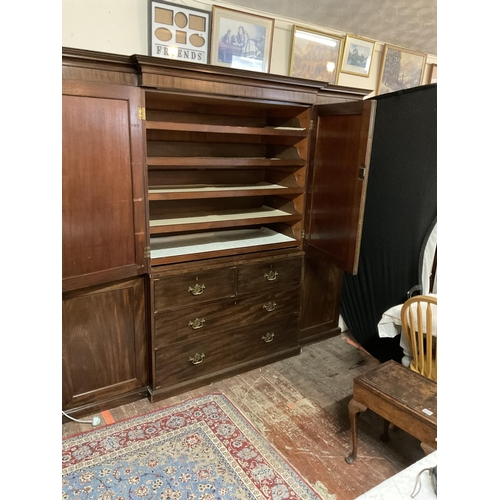 632 - GEORGIAN BREAK FRONT MAHOGANY COMPACTOM WARDROBE. 2 CUPBOARD DOORS OVER 4 DRAWERS FLANKED BY 2 HANGI... 