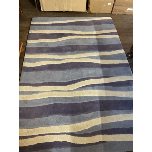 678 - 2 PATTERNED RUGS
BLUE RUG 48 X 72