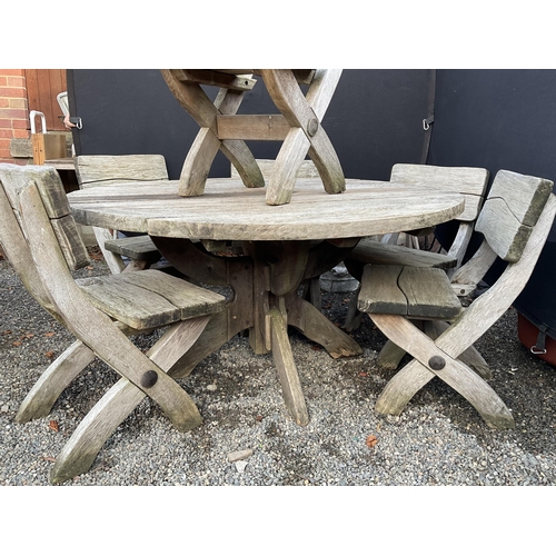 50 - LARGE OAK GARDEN TABLE WITH 6 HEAVY MATCHING WOODEN CHAIRS STAMPED ACORN HARDWOOD FURNITURE
DIA 55