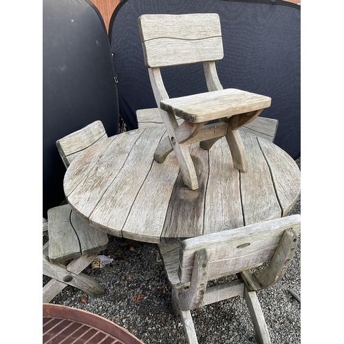 50 - LARGE OAK GARDEN TABLE WITH 6 HEAVY MATCHING WOODEN CHAIRS STAMPED ACORN HARDWOOD FURNITURE
DIA 55