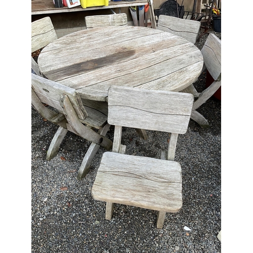 50 - LARGE OAK GARDEN TABLE WITH 6 HEAVY MATCHING WOODEN CHAIRS STAMPED ACORN HARDWOOD FURNITURE
DIA 55