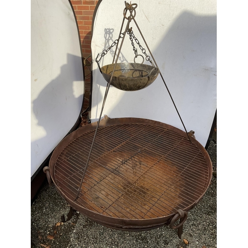 54 - OVER SIZED CAST IRON GARDEN FIRE PIT ON STAND WITH COOKING POT ON TRIPOD COMPLETE WITH METAL COOKING... 