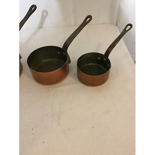 272 - 4 GRADUATED COPPER SAUCEPANS