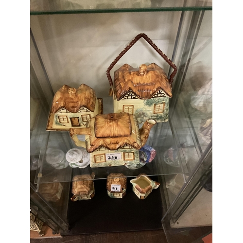 218 - LARGE QTY OF NOVELTY TEA POSTS COTTAGE WARE ITEMS ETC