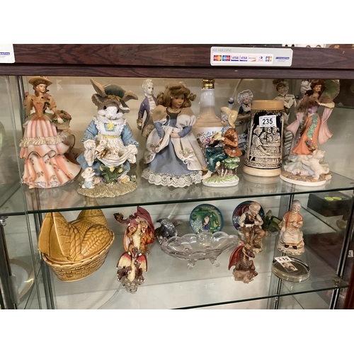235 - 2 SHELVES OF SUNDRY FIGURES ETC TO INCLUDE COMMERATIVE STAMP PAPERWEIGHT, ASSORTED DRAGONS, ETC